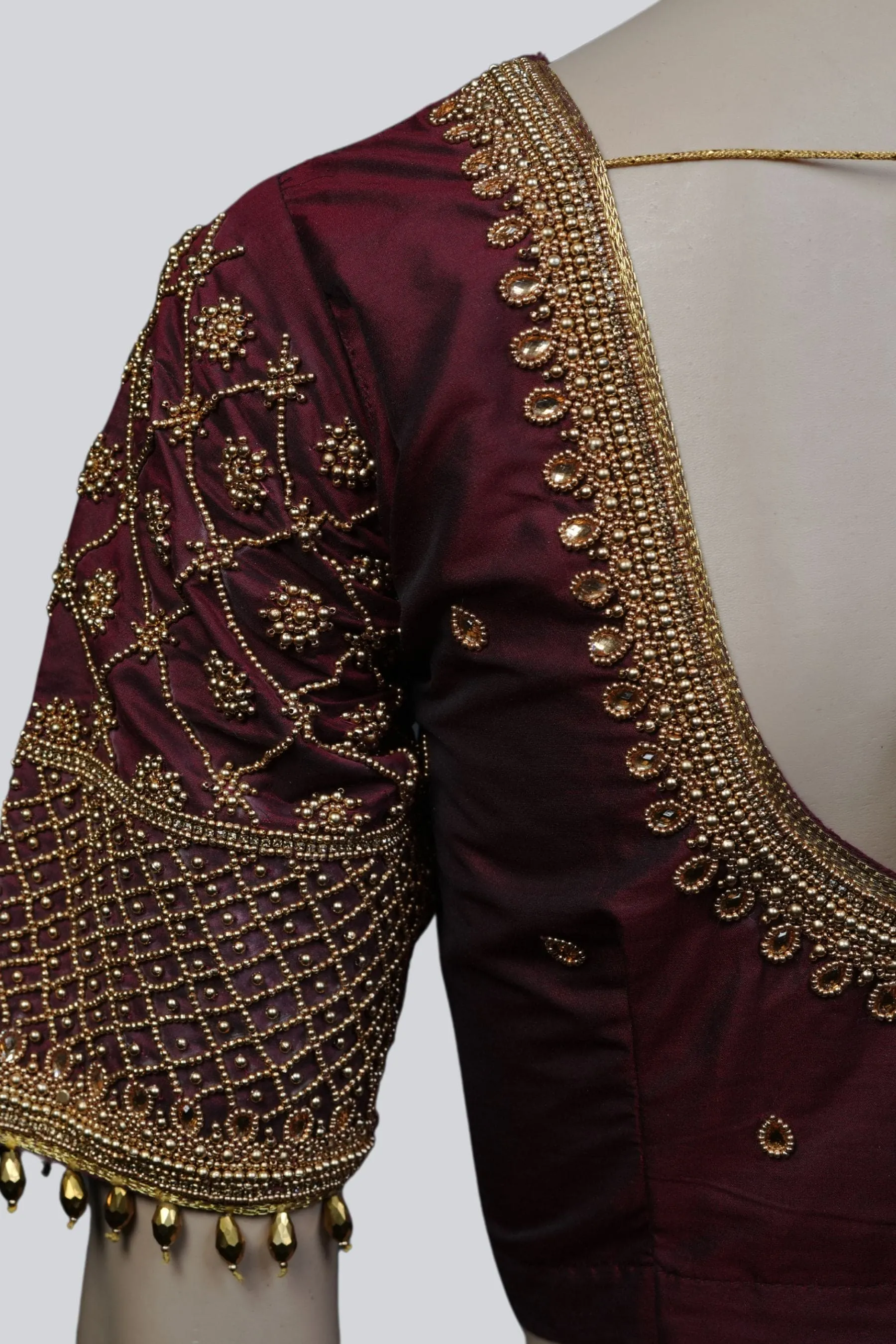 Luxurious Aari-Work Bridal Blouse with Fancy Tassels by JCS Fashions