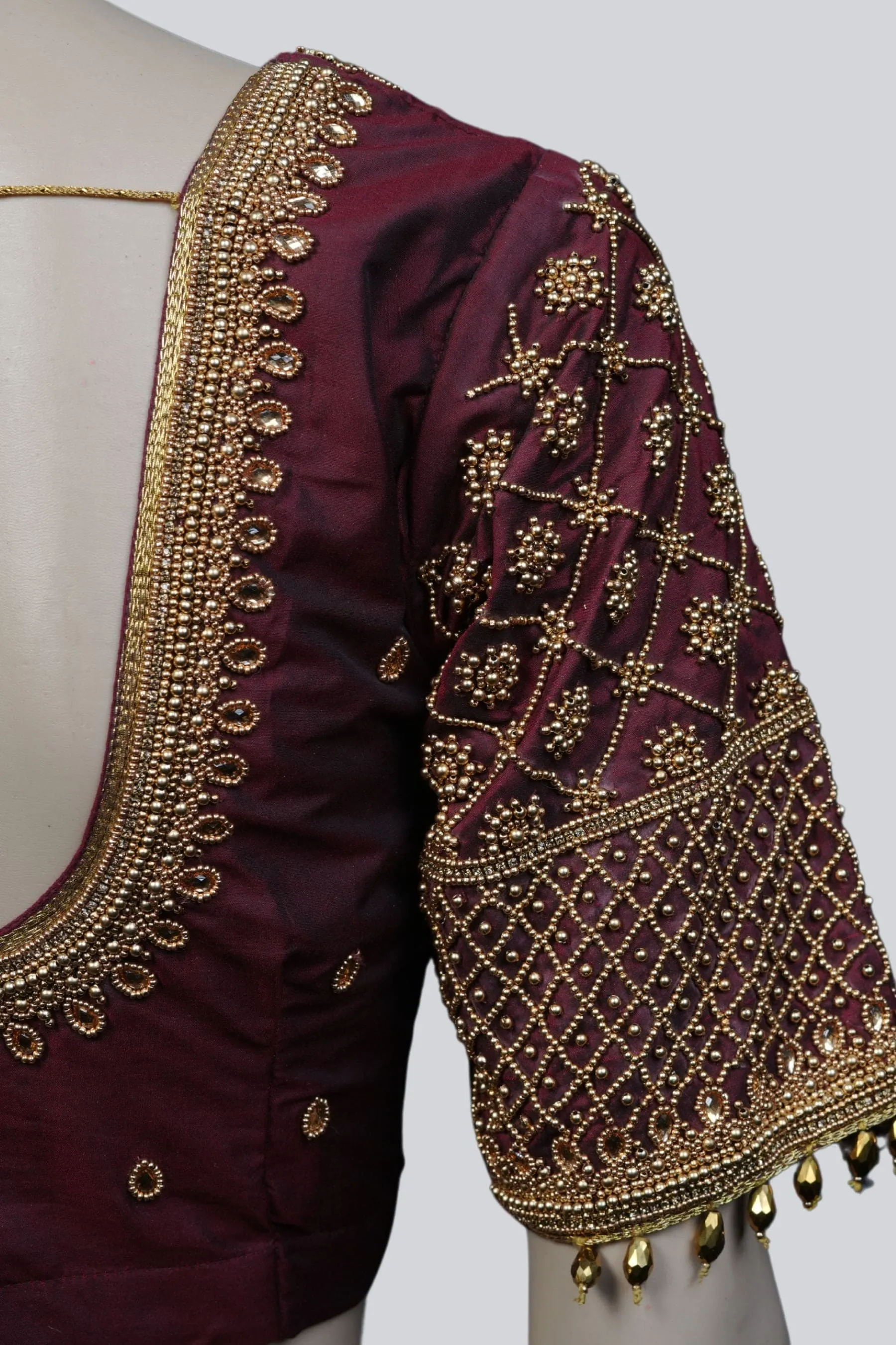 Luxurious Aari-Work Bridal Blouse with Fancy Tassels by JCS Fashions